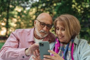 estate planning inaction, image of a couple looking at a smartphone