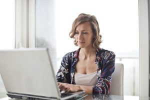 effective estate planning, image of woman on a laptop