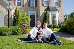 Family in front of their new home; Bluffton asset protection
