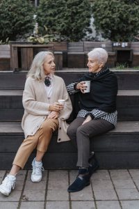 living trust, image of two senior women chatting outdoors