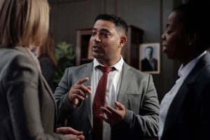 successor trustee, image of man in suit speaking with colleagues