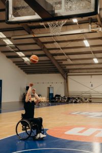 special needs planning, image of a man in a wheelchair shooting a basketball