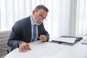 Can a Trust Own a Life Insurance Policy, image of a man working at a desk