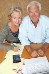 who manages my living trust, image of middle-aged couple